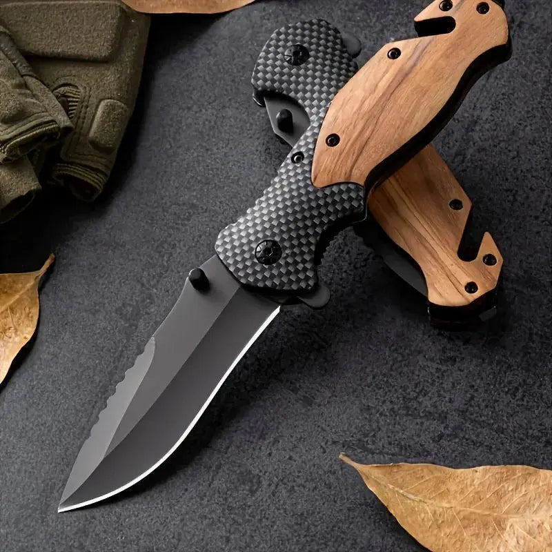 Folding knife with a partially serrated stainless steel blade, wooden and carbon fiber-patterned handle, placed against a bundle of black braided rope.